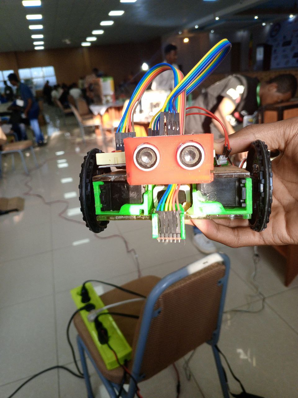 Researchers testing an electronics prototype in a lab